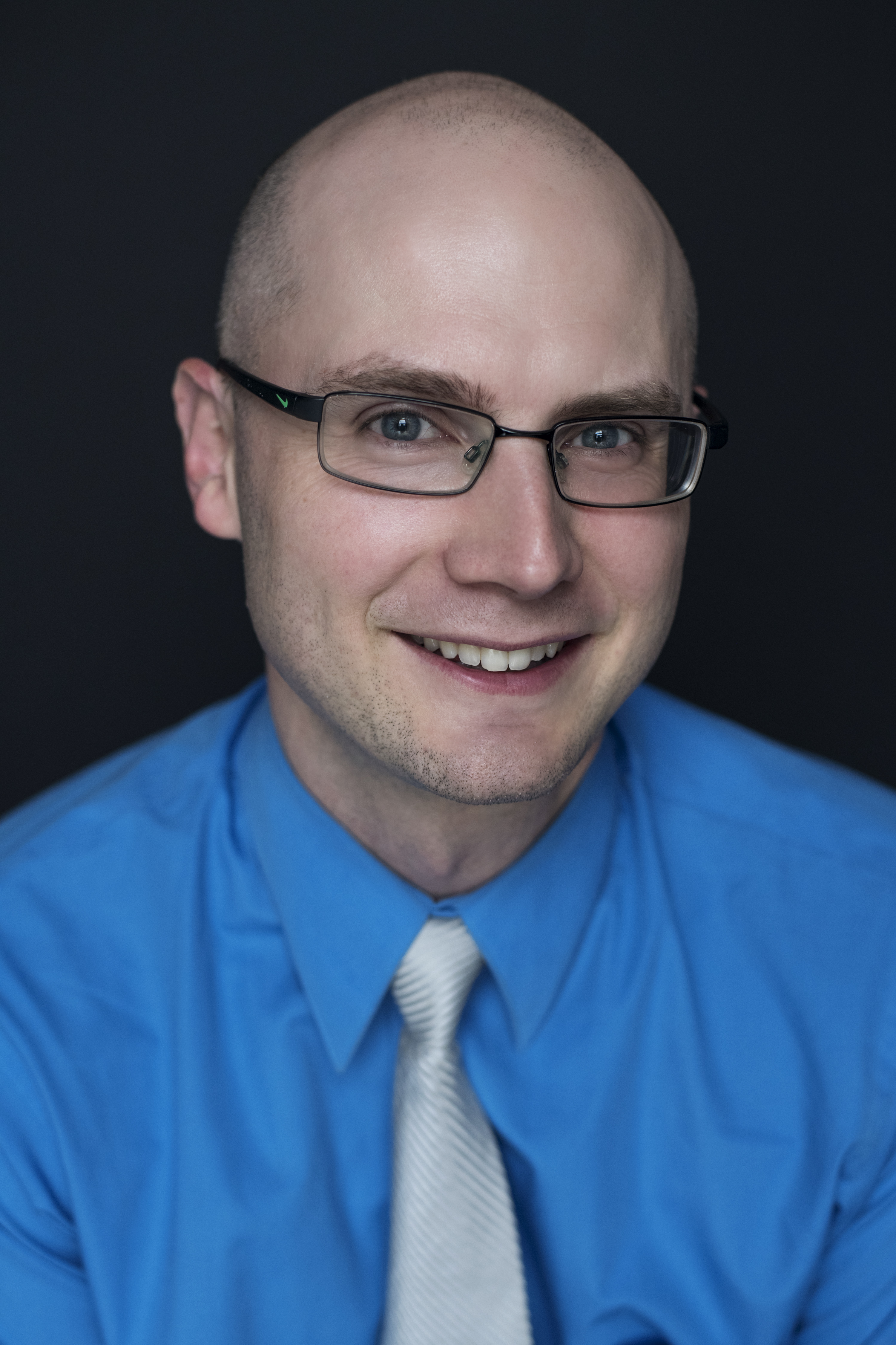Portrait of Kamil Dobrowolski wearing glasses